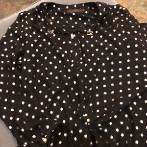 Black top with gold clasp detailing at bust